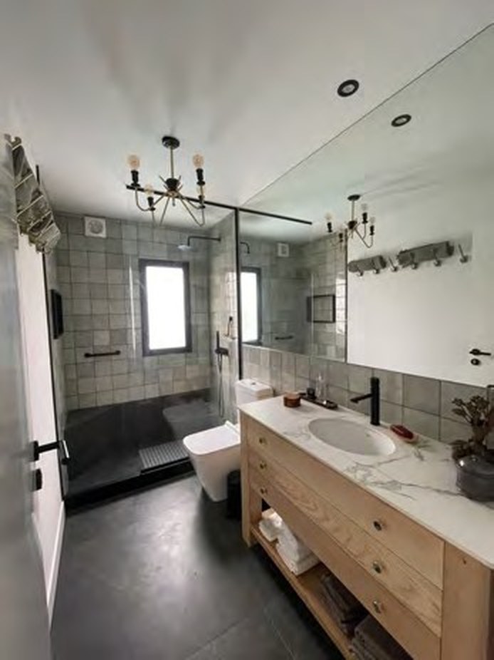 Bathroom with walk-in shower and brass fittings